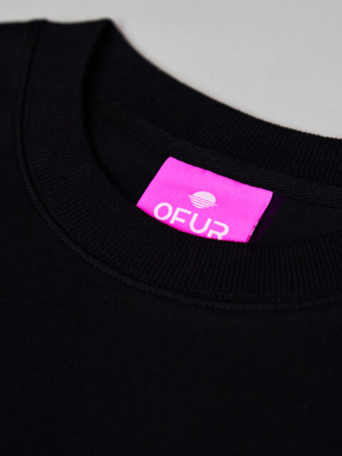 Close up of the OFUR neck label in the black T-Shirt