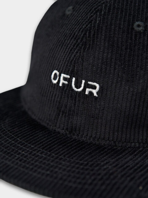 Close up of the OFUR corduroy script cap from the front