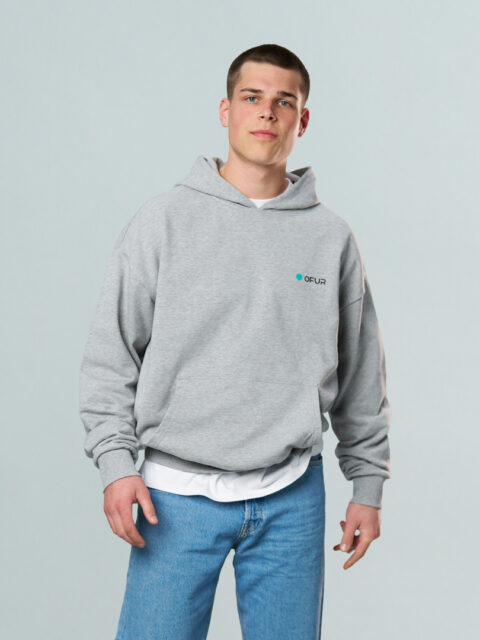 Model wearing the grey OFUR hoodie with the OFUR logo on the left side of the chest