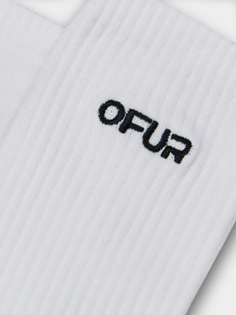 Close up of the white OFUR embroidered socks with black logo