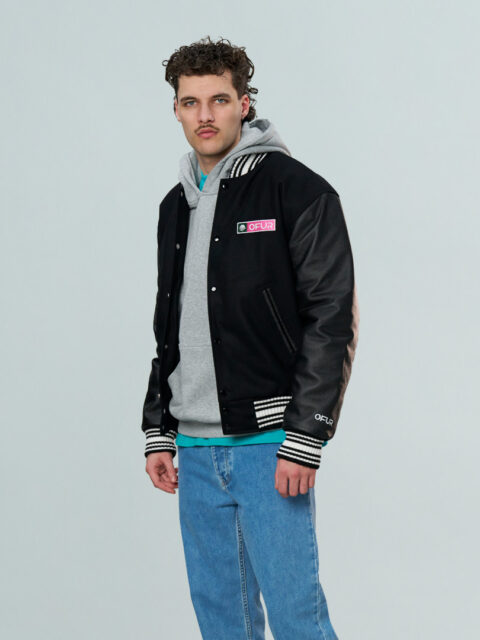 Model wearing the OFUR fire punch varsity jacket seen from the front