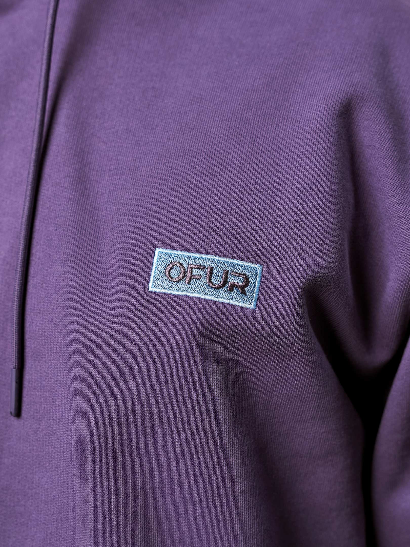 OFER_FW25_RISE_APPLIQUE_PURPLE_HOODIE_CLOSE_UP_FRONT_1