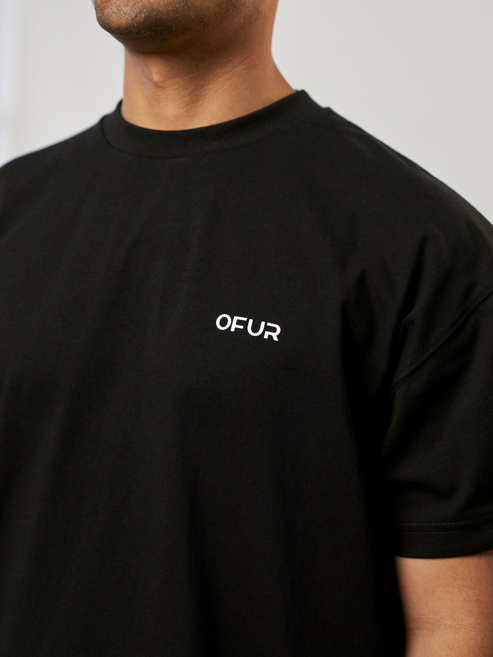 OFUR_FW25_COMMUNITY_ORIGINAL_TSHIRT_CLOSE_UP_FRONT_1