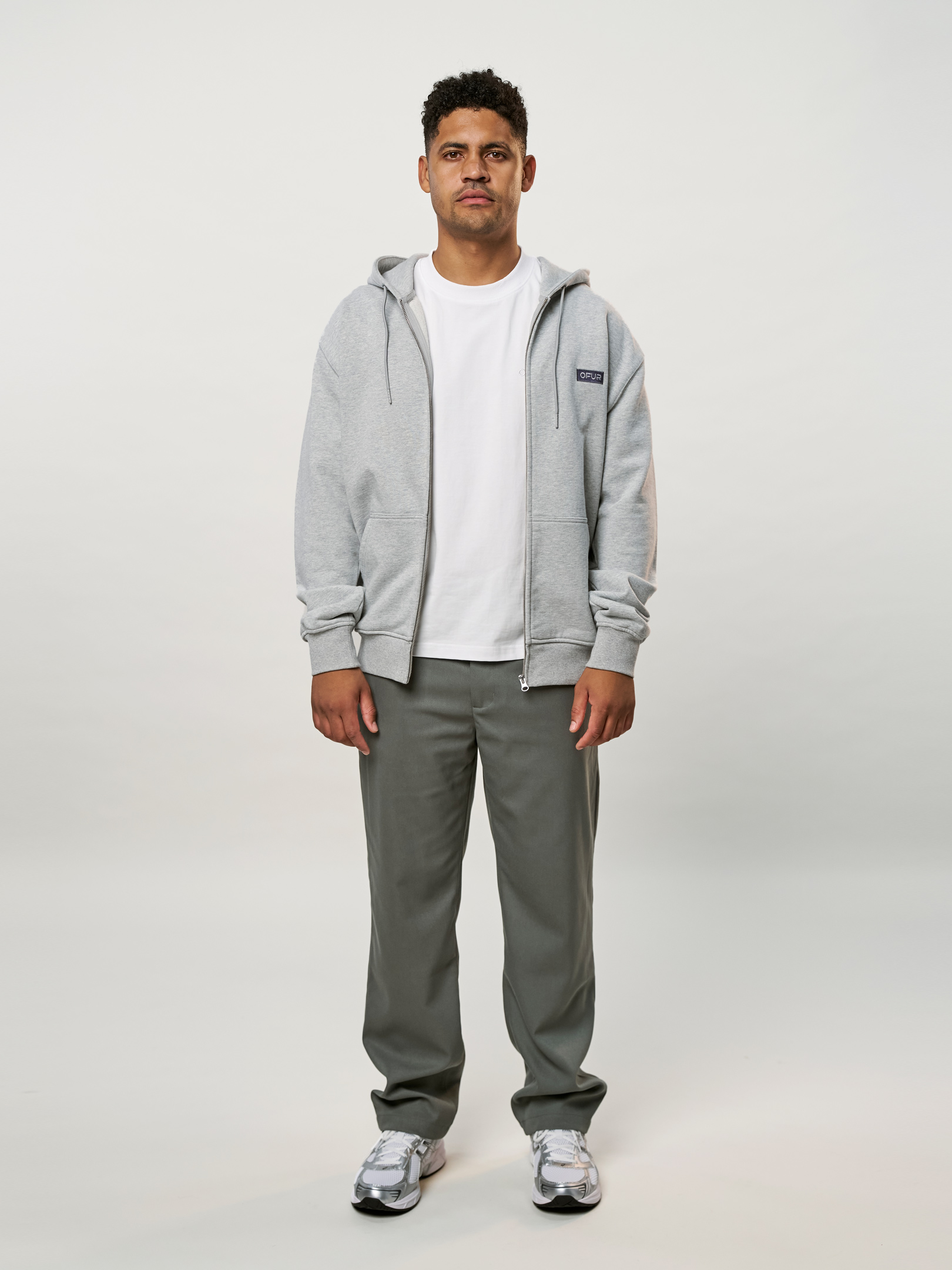 OFUR_FW25_RISE_APPLIQUE_ZIP_HOODIE_FULL_BODY_FRONT_1
