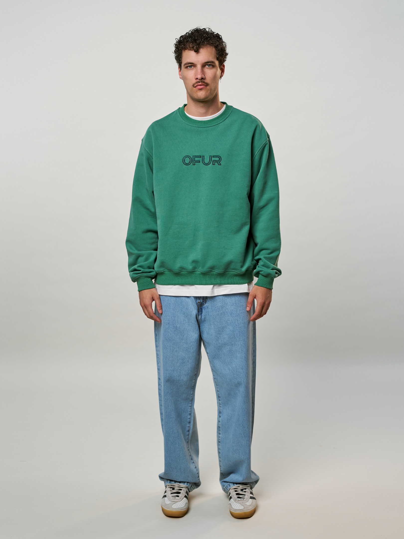 OFUR_FW25_SCRIPT_APPLIQUE_GREEN_CREWNECK_FULL_BODY_FRONT_1