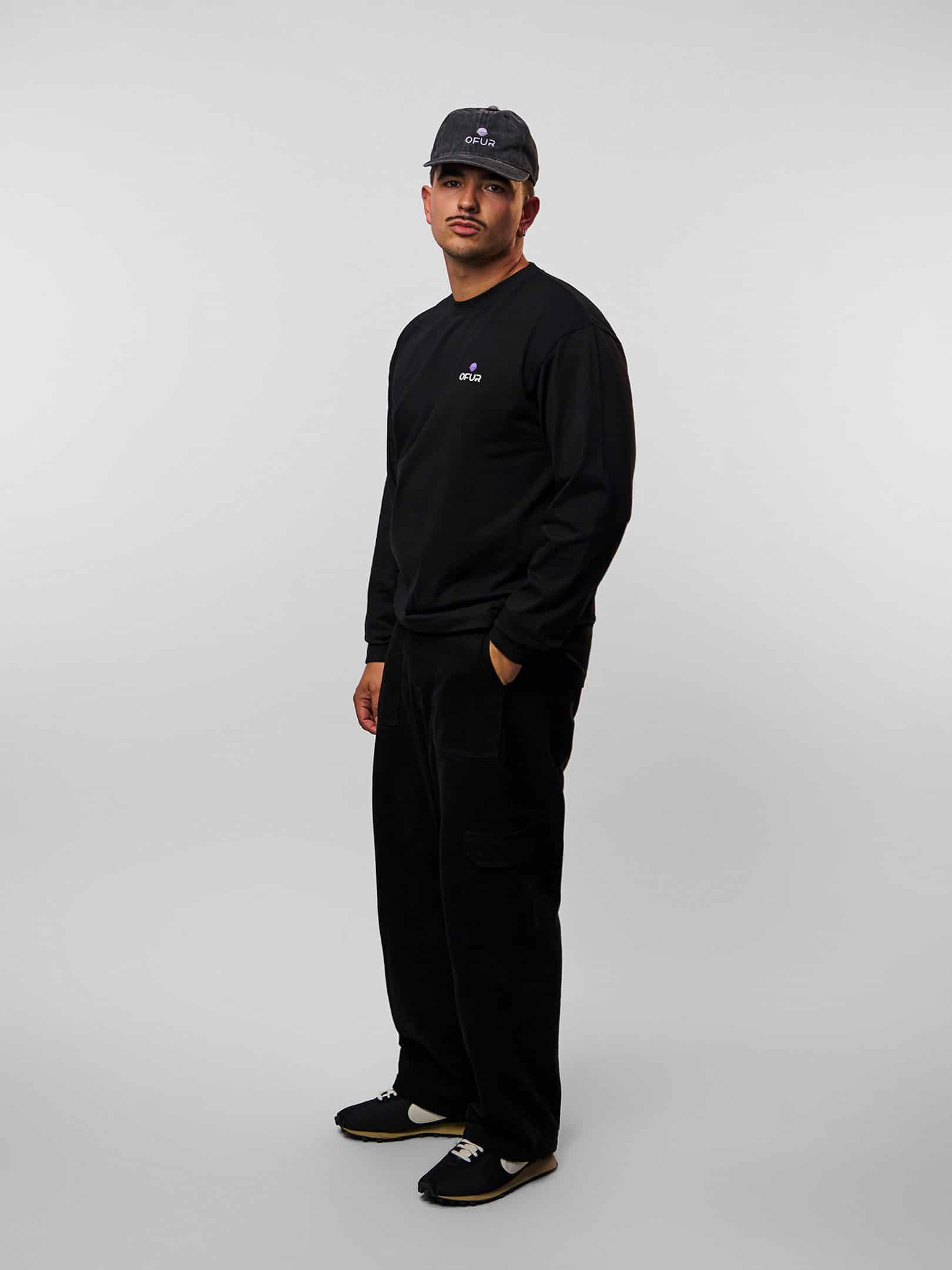 OFUR_FW26_RISE_BEYOND_PURPLE_LONGSLEEVE_BLACK_FULL_BODY_SIDE_1